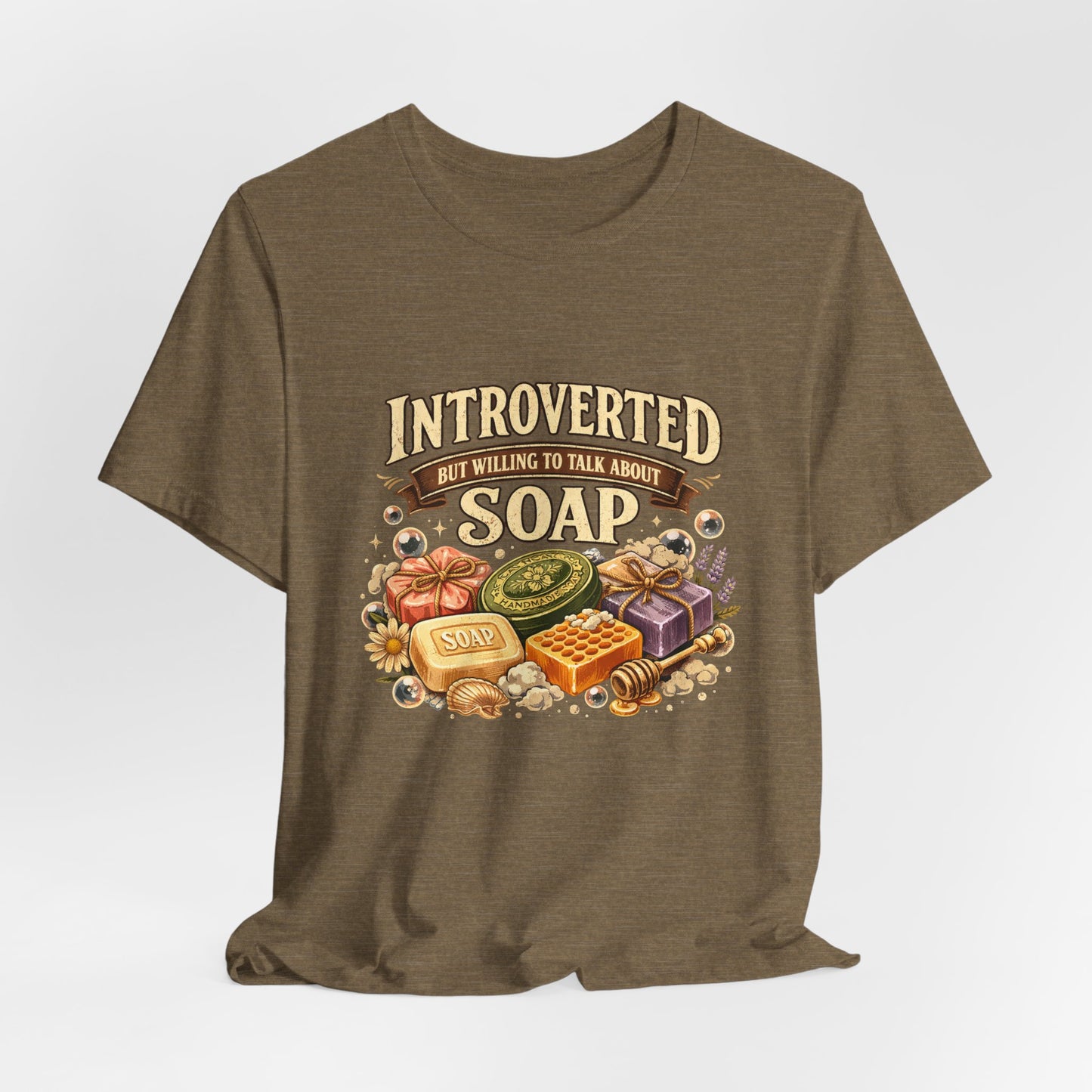 Brown t-shirt with soap-themed graphic and text that says Introverted but willing to talk about soap on a white background