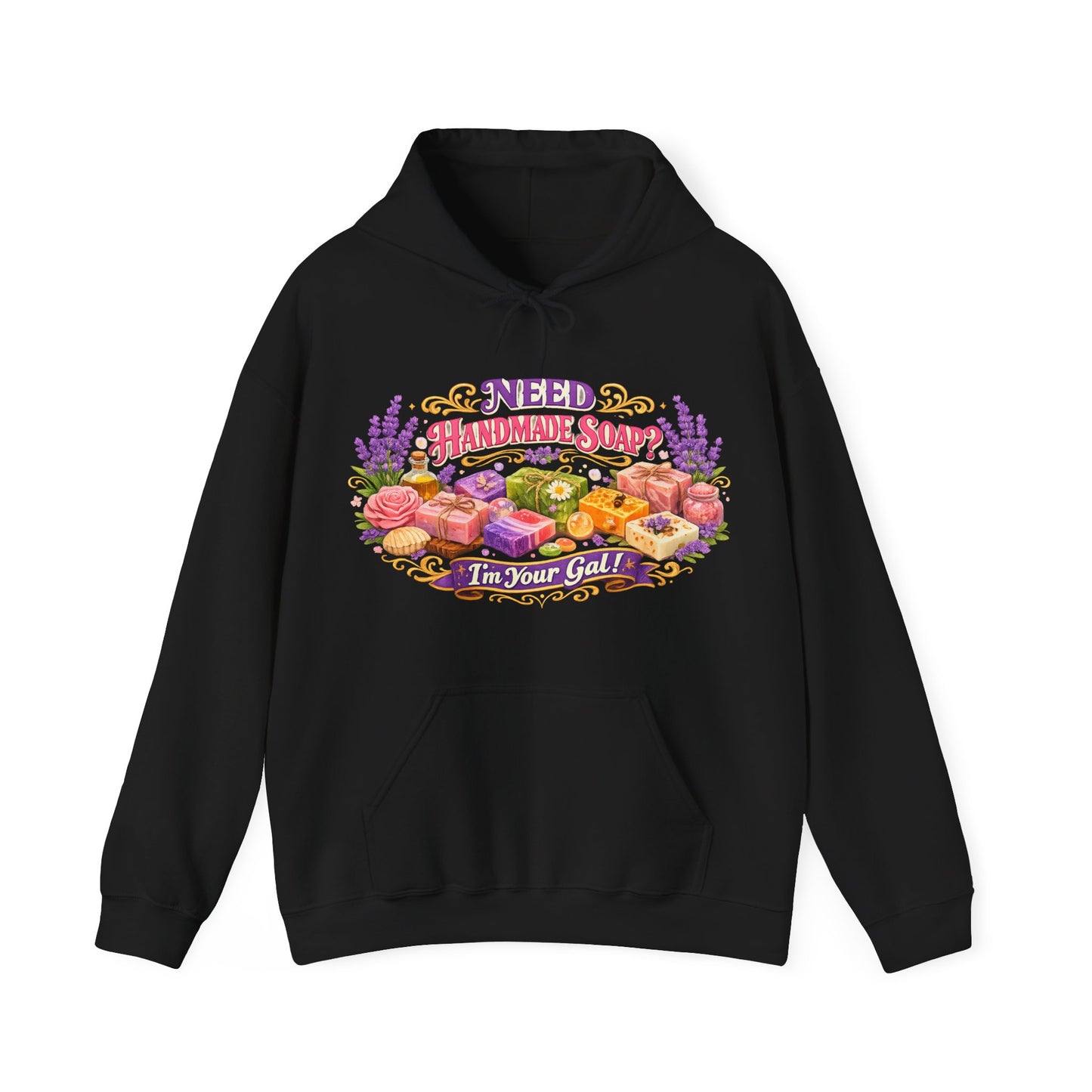 Black hoodie displays a vibrant graphic of colorful, handmade soaps surrounded by lavender and roses, promoting handcrafted bath products.
