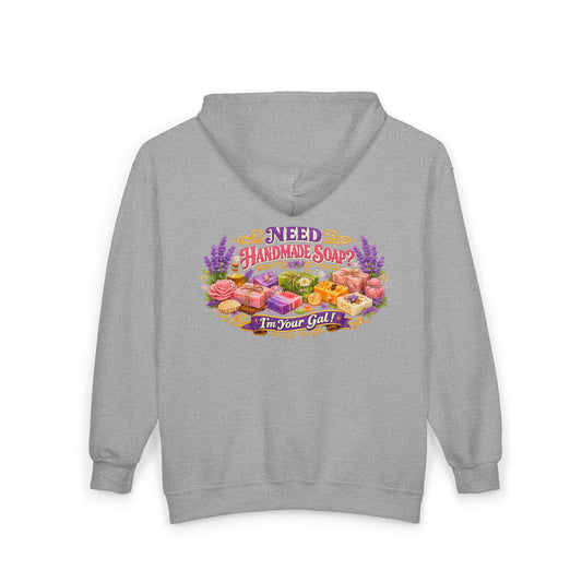 Gray hoodie displays an illustration promoting artisan handmade soap with the phrase "Need Handmade Soap? I'm Your Gal!".
