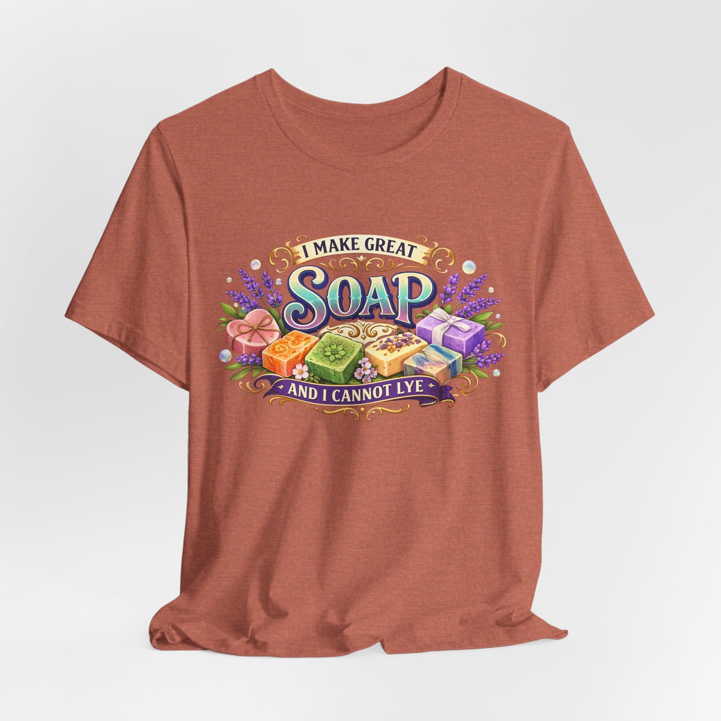 Terra cotta T-shirt displays a colorful illustration of handcrafted soap bars with the text "I make great soap and I cannot lye".
