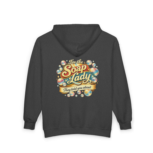 Black hoodie with colorful graphic a that says I’m the soap lady they told you about  on the back against a white background