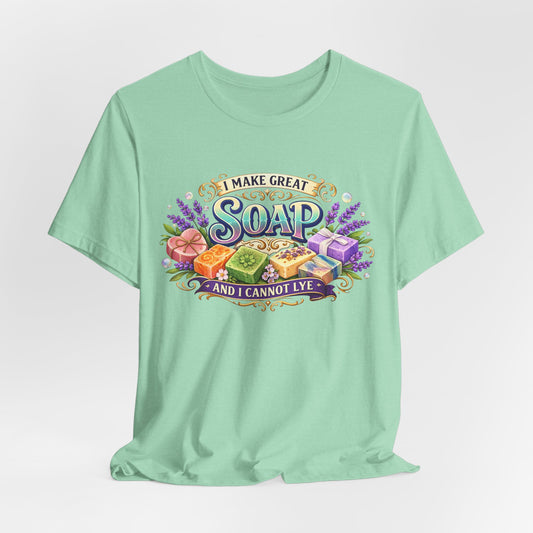 Mint green t-shirt displays colorful artisan soaps and the saying "I make great soap, and I cannot lye."
