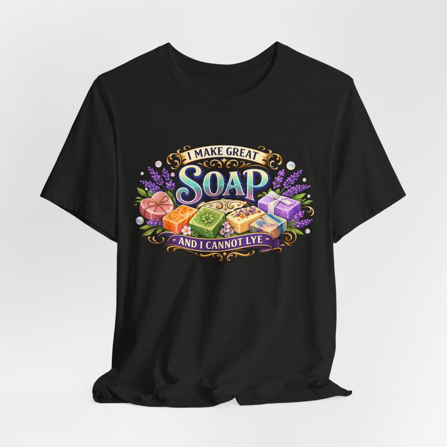 Black t-shirt displays a colorful "I Make Great Soap and I Cannot Lye" graphic with handmade soaps and lavender.
