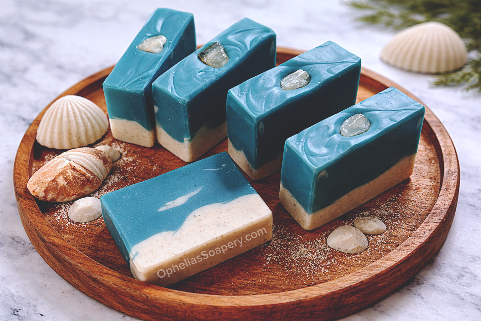 Ocean themed blue and white soap sitting on a wood platter